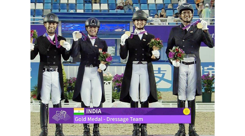 Indian Dressage Team posing with Gold Medal. Indian Dressage Team posing with Gold Medal.