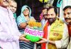 Former Minister and senior BJP leader Mukhtar Abbas Naqvi collects a pinch of rice in 'Amrit Kalash' from every house of Villege Patwai under the 'Meri Maati Mera Desh' campaign, in Rampur, Uttar Pradesh.