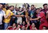 Chief Secretary Dr Arun Kumar Mehta presenting trophy to a winning team.