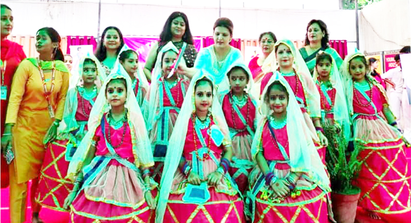 Chief guests posing with students in colourful dresses during folk dance completion at Jammu. Chief guests posing with students in colourful dresses during folk dance completion at Jammu.