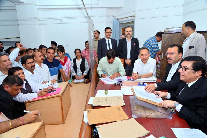 Executive Chairman, J&K Legal Services Authority, Justice Tashi Rabstan and other judges during National Lok Adalat at District Court Complex, Janipur in Jammu.