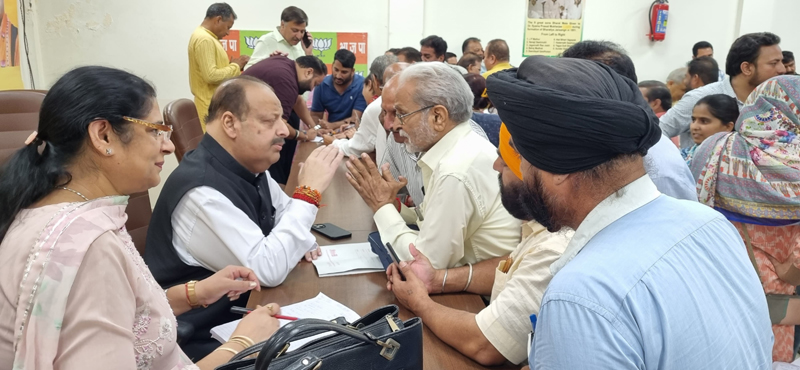 Senior BJP leader Devender Singh Rana listening public grivances at party headquarter. Senior BJP leader Devender Singh Rana listening public grivances at party headquarter.