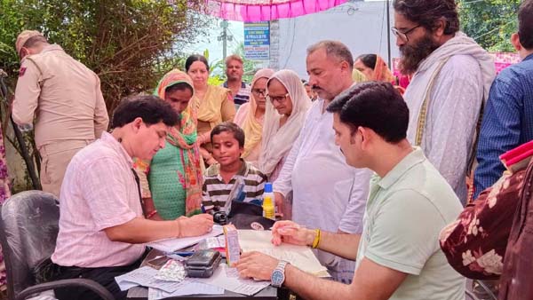 Dr Kailash Chander giving his services during a medical camp at Nagrota. Dr Kailash Chander giving his services during a medical camp at Nagrota.