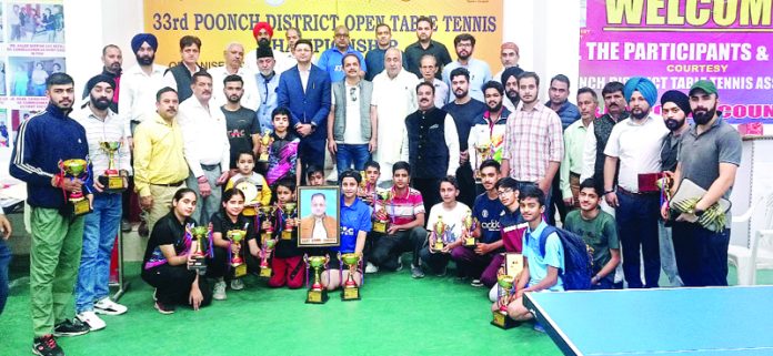 Players posing with dignitaries during 33rd Riaz Ahmed Memorial Table Tennis Championship at Poonch.