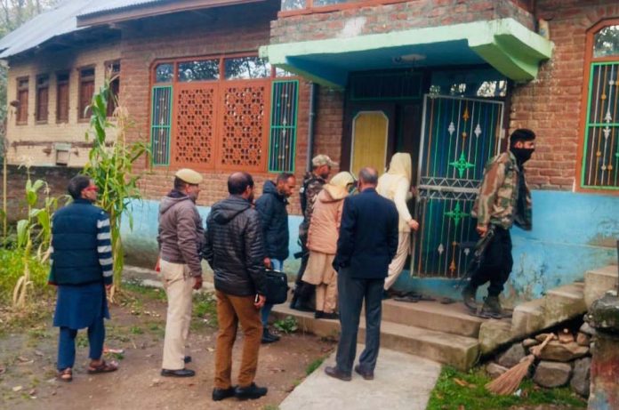 CIK sleuths during raid at a house in Kashmir on Thursday. -Excelsior/Sajad Dar