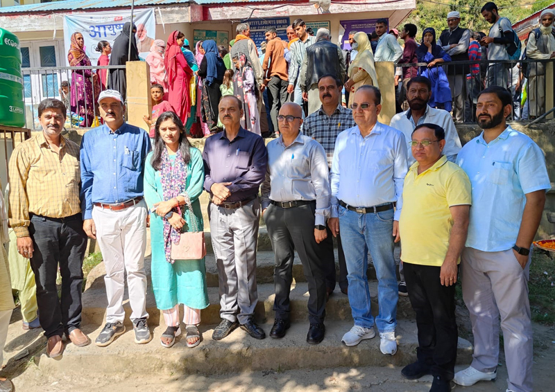 Patients and doctors during a mega medical check- up camp at Bani on Friday. Patients and doctors during a mega medical check- up camp at Bani on Friday.
