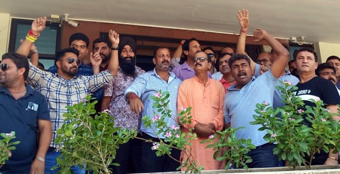 PWD contractors raising slogans in support of their demands in Jammu.