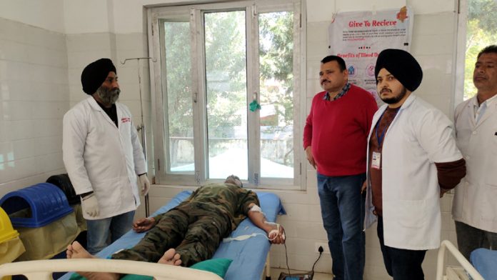 A jawan donating blood during a camp at Mendhar. -Excelsior/Rahi Kapoor