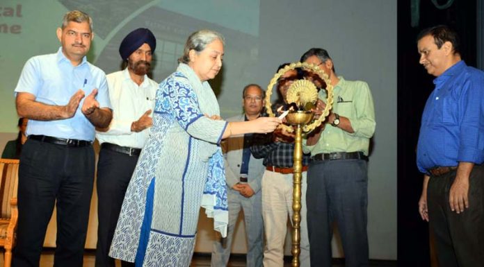 Guests lighting ceremonial lamp during inaugural of Scientific & Technical Outreach Program at SMVDU on Wednesday.