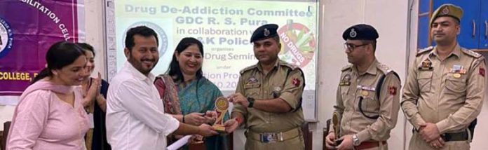 SP Headquarters Ramnish Gupta with a college student in RS Pura on Wednesday.