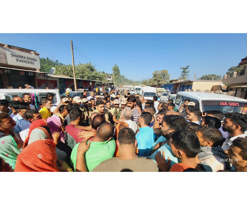 Police officers trying to pacify protesting people at Bhaga on Thursday. Police officers trying to pacify protesting people at Bhaga on Thursday.