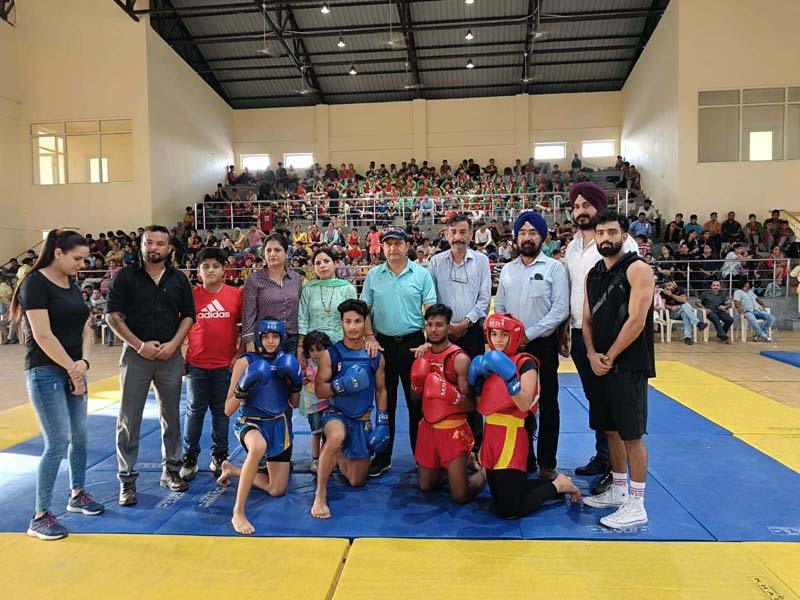 Wushu athletes posing with dignitaries in Jammu. Wushu athletes posing with dignitaries in Jammu.