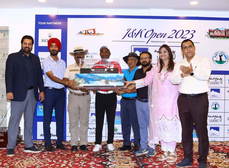 Champion Om Prakash Chouhan receiving trophy from Amarjeet Singh, Special Secretary to Government, J&K Tourism Department, Sunaina Sharma Mehta, Joint Director, Tourism, Jammu and Manav Gupta, Secretary, Jammu Tawi Golf Course on Saturday. Champion Om Prakash Chouhan receiving trophy from Amarjeet Singh, Special Secretary to Government, J&K Tourism Department, Sunaina Sharma Mehta, Joint Director, Tourism, Jammu and Manav Gupta, Secretary, Jammu Tawi Golf Course on Saturday.