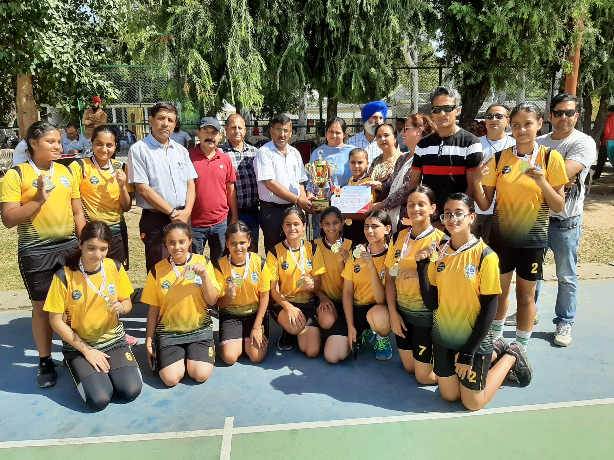 Basketball players posing with trophy and dignitaries at Udhampur on Thursday. Basketball players posing with trophy and dignitaries at Udhampur on Thursday.