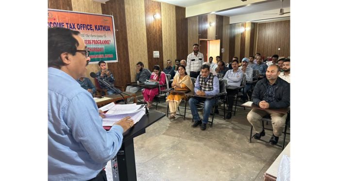 Income Tax Officer speaking during an outreach programme.