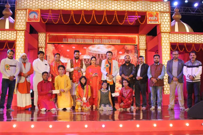 Guests and organizers with the preliminary round winners on third day of Devotional Song Competition at Katra. Guests and organizers with the preliminary round winners on third day of Devotional Song Competition at Katra.
