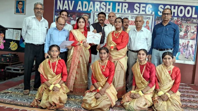 Students posing with certificates during National Group Song Competition at Kathua.