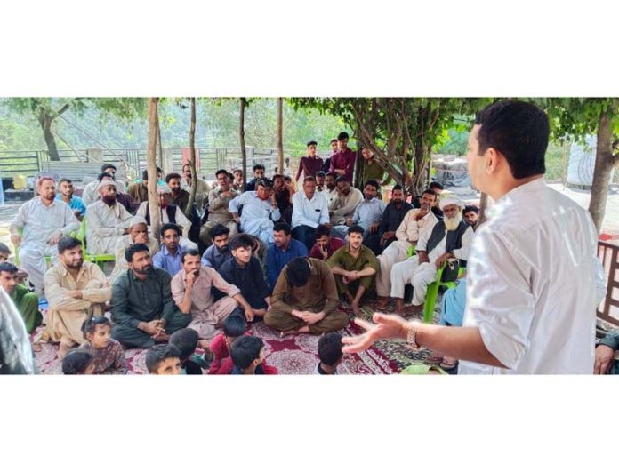 BJP leader, Ranbir Singh Pathania addressing a gathering at Ramnagar on Friday.