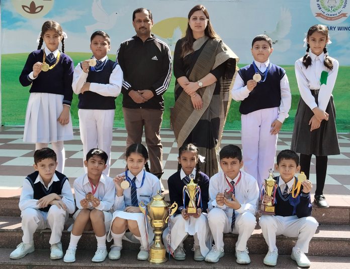 Headmaster BSF School, Sonia Gupta posing with Judo players and coach.