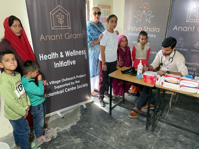 Doctor checking the patients during a health check-up camp in Jammu on Sunday. Doctor checking the patients during a health check-up camp in Jammu on Sunday.