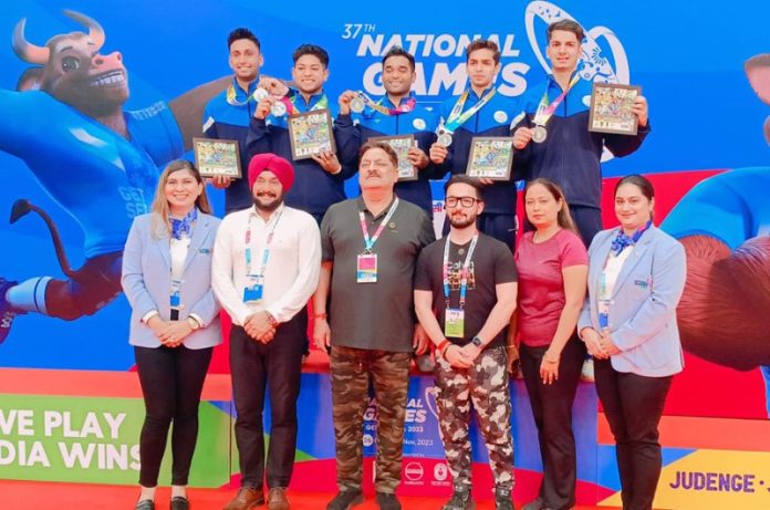 Gymnasts posing with Er Kiran Wattal and team management at National Games, Goa on Friday.