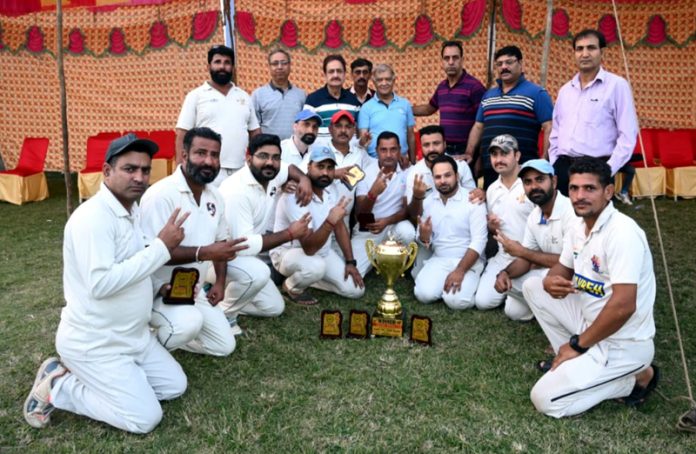 Winning team posing with trophy at KC Sports Club Ground, Jammu.