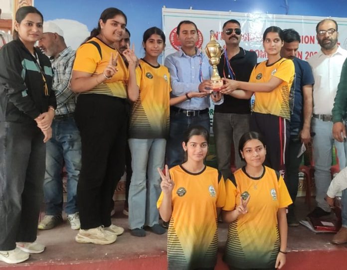 Chess players posing with trophy and dignitaries. — Excelsior/Shubham Anthal