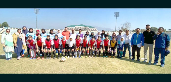 Football team of girls posing after winning provincial-level football tournament in Srinagar. Football team of girls posing after winning provincial-level football tournament in Srinagar.