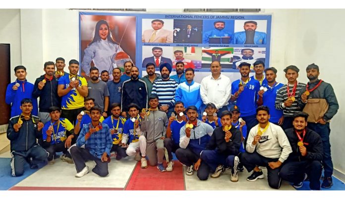 Fencers posing with medals during a championship at Jammu University.