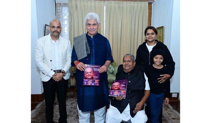 Lieutenant Governor Manoj Sinha releasing a book titled “Warrior on Wheels-Wheelchair to Padam Shri.