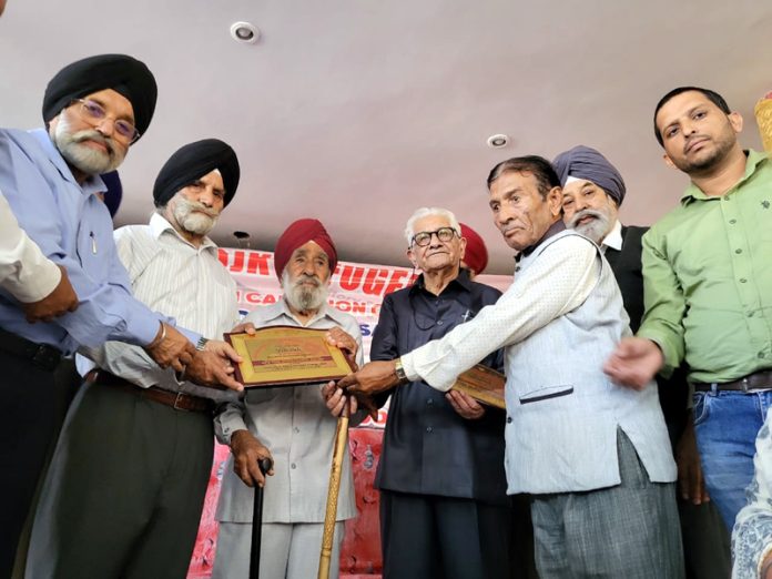 Elderly members of PoJK DPs witness to Pak raids in 1947 being felicitated during a function in Jammu. -Excelsior/Rakesh