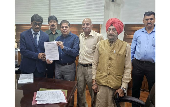 SOS International chairman Rajiv Chuni presenting a memorandum to Chief Secretary Dr Arun Kumar Mehta.