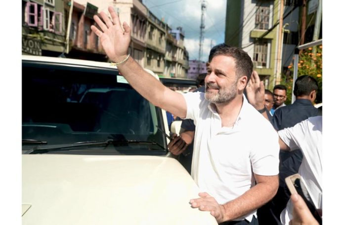 Congress leader Rahul Gandhi waving supporters at a public meeting at Lunglei, in Mizoram on Tuesday. (UNI)