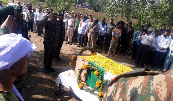 Army, Police and civilians paying final respect to the mortal remains of Subedar Balbir Singh at his native village Mandiyal in Samba District on Wednesday.