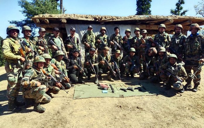 Search party with arms and ammunition recovered from a terrorist hideout in Seoj Dhar area of Doda District on Wednesday. Search party with arms and ammunition recovered from a terrorist hideout in Seoj Dhar area of Doda District on Wednesday.