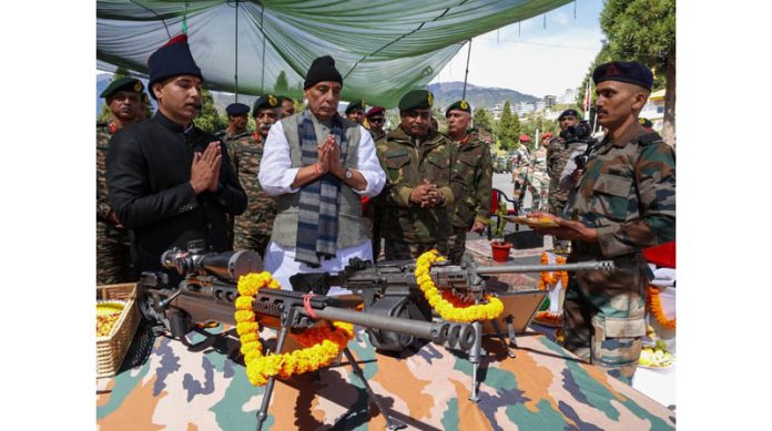 Defence Minister Rajnath Singh perform Shastra Puja on the occasion of Dusshera festival during his visit to forward posts in Arunachal Pradesh on Tuesday. (UNI) Defence Minister Rajnath Singh perform Shastra Puja on the occasion of Dusshera festival during his visit to forward posts in Arunachal Pradesh on Tuesday. (UNI)