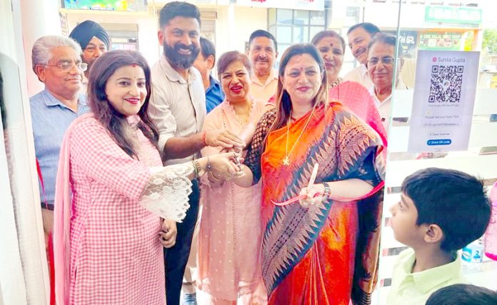 BJP leader, Rekha Mahajan, and Councillor, Anil Kumar, inaugurating a showroom at Greater Kailash, Jammu, on Sunday.