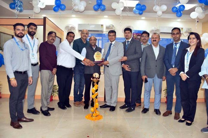 Dignitaries posing for a group photograph at the inauguration of Bank of Maharashtra branch in Bari Brahmana on Wednesday.