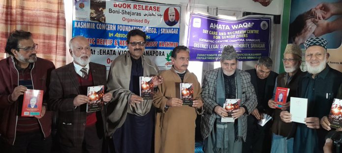 Prof. Mohd Zaman Azurda and Rtd Justice Rashid Ali Dar releasing a book in a function at Srinagar on Monday.