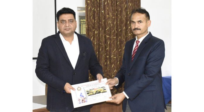 SSP Rajinder Kumar Gupta, Deputy Director SKPA Udhampur, awarding a participant on the concluding day of a course on juvenile justice in Udhampur on Saturday.