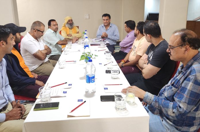 Members of Devotional Song Competition Committee during a meeting.
