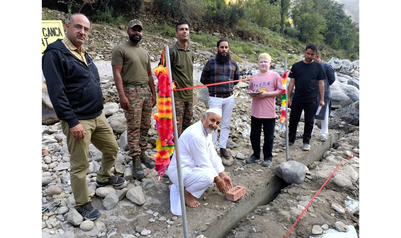 Ravinder Pandita, head of Save Sharda Committee laying foundation stone of bathing ghat on river Kishenganga near Teetwal on Tuesday. Ravinder Pandita, head of Save Sharda Committee laying foundation stone of bathing ghat on river Kishenganga near Teetwal on Tuesday.