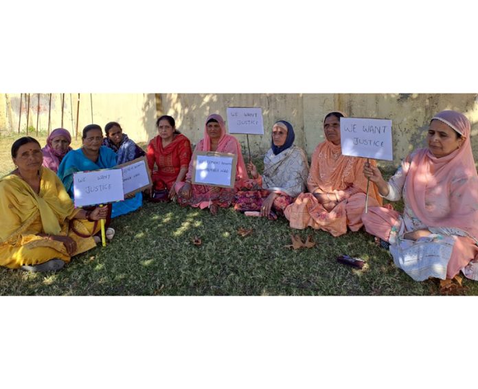 Retired Anganwadi workers and helpers staging protest in Bhaderwah on Thursday.