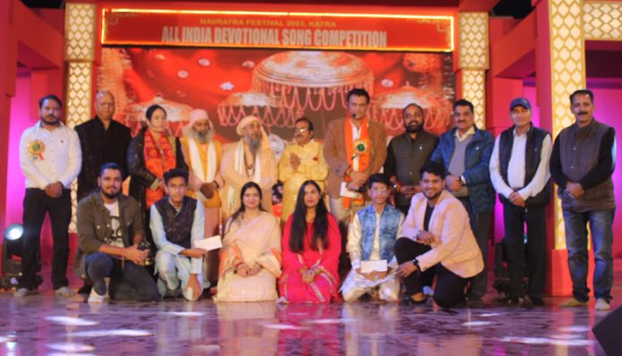 Dignitaries pose for a photograph during ongoing All India Devotional Song Competition in Katra.