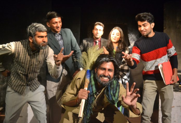A scene from Hindi play 'Sarkari Daftar Ka Ek Din' staged at Jammu on Sunday.