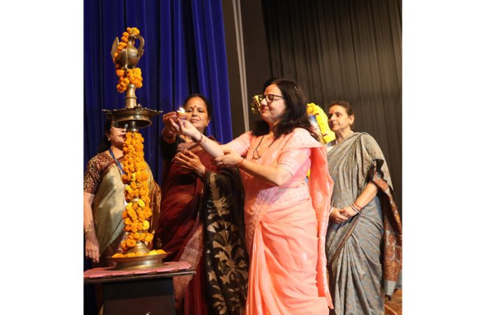 Dignitaries lighting the lamp during the women's conference at Jammu on Sunday. — Excelsior/Rakesh
