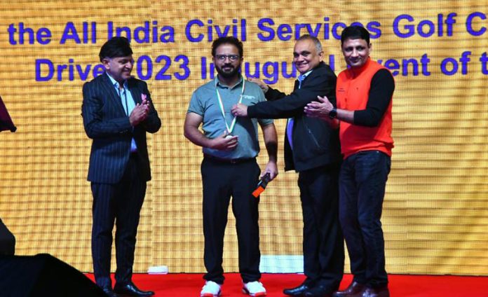 Manav Gupta, Secretary of Jammu Tawi Golf Course receiving medal from dignitaries.