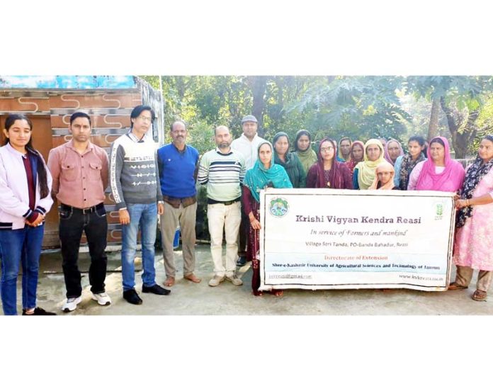 Farmers and Scientists of KVK Reasi pose for a group photograph during a programme on PM-KISAN scheme at Panasa village on Wednesday.