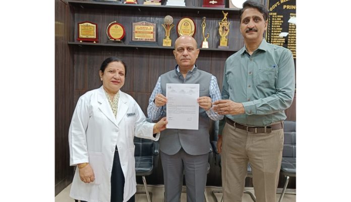 Principal and Dean, GMC Jammu, Dr Ashutosh Gupta showing certificate received by the hospital for being a registered Medical Centre for Palliative Care. Principal and Dean, GMC Jammu, Dr Ashutosh Gupta showing certificate received by the hospital for being a registered Medical Centre for Palliative Care.