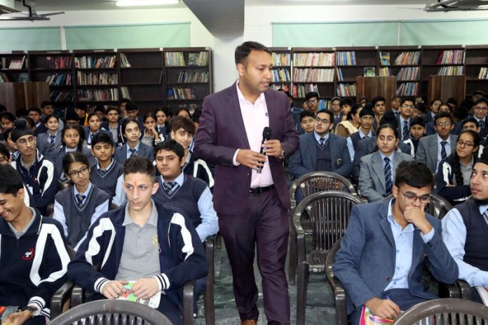 Resources Person Arvind Mahajan interacting with students during a workshop on Saturday.